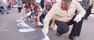 Activists paint over spice advertisements.